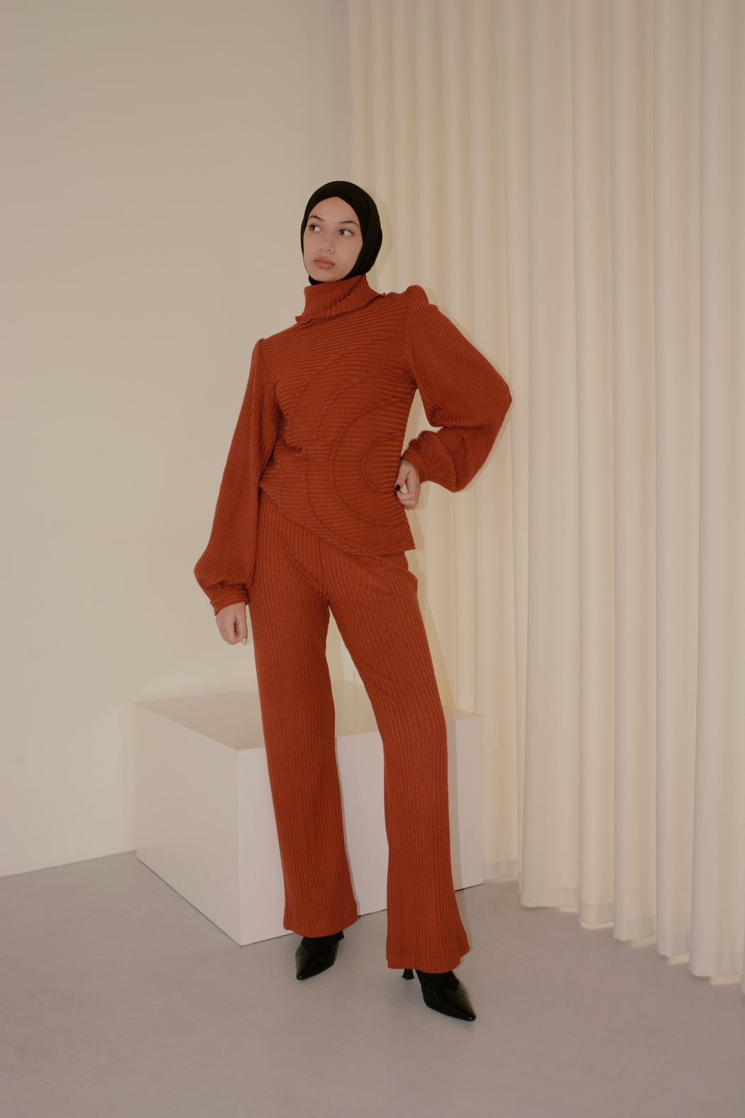 georgia hardinge serra jumper ribbed jersey knit turtleneck terracotta red orange rust puff sleeve tucks