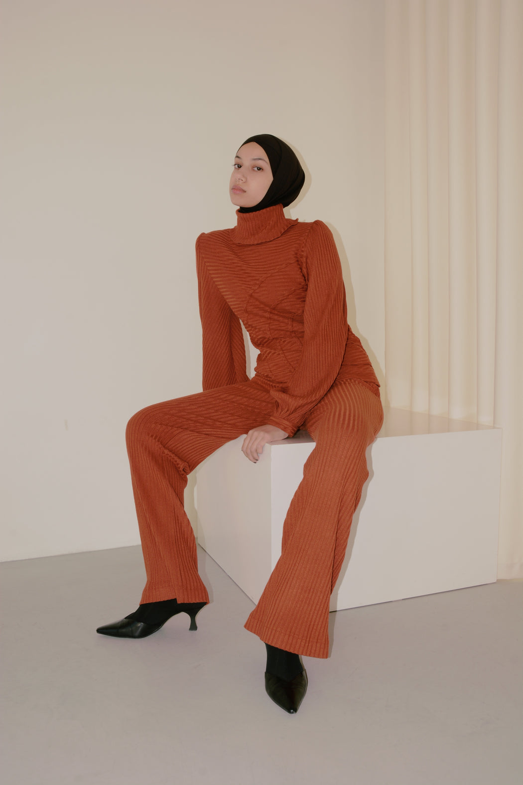 georgia hardinge serra jumper ribbed jersey knit turtleneck terracotta red orange rust puff sleeve tucks